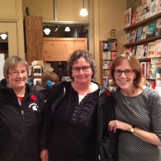 The lovely Denise Roig posing with a couple audience members